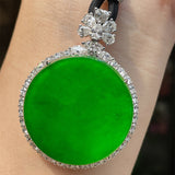 A Quality Circular Jadeite Pendant with Zirconia Surround and Cord
